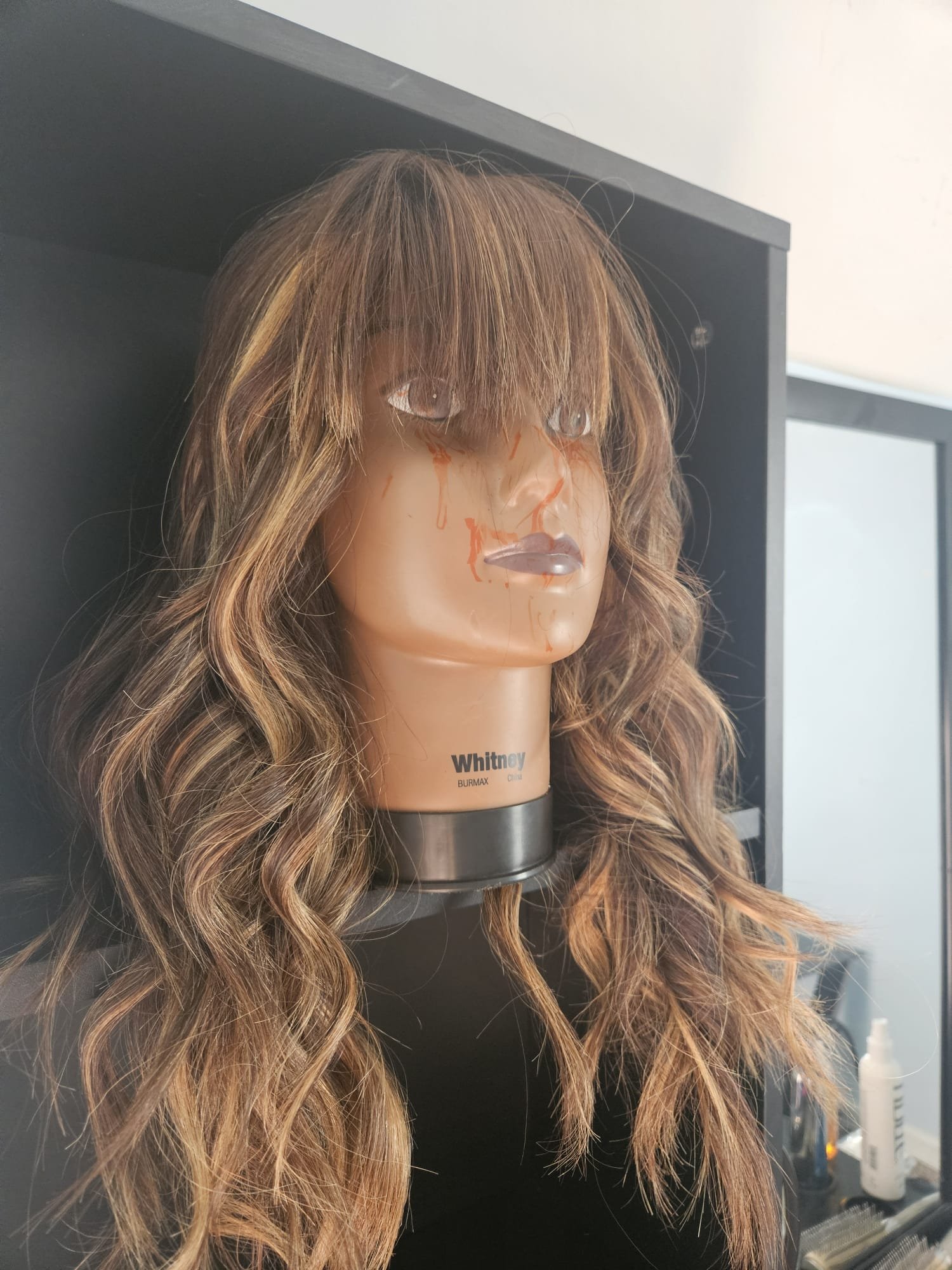 Long wig cut and styled by Addi.