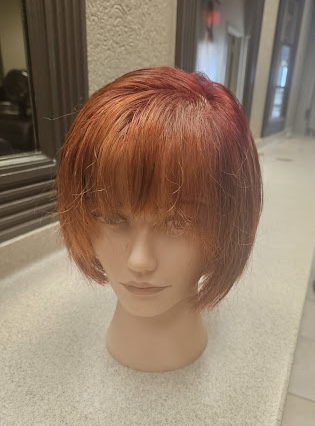 Short wig cut and styled by Addi.